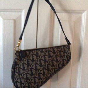 Dior Blue Wristlet with gold hardware.